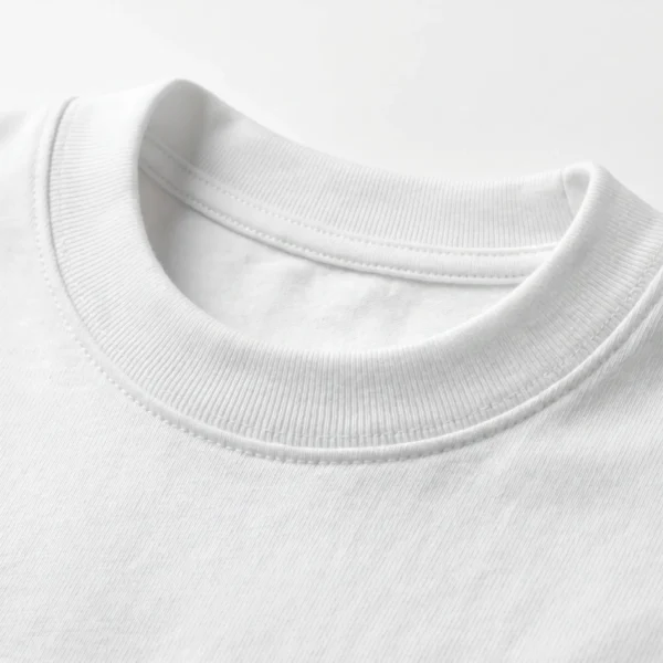 Close-up of the thick ribbed collar on a Blnk heavyweight combed cotton white t-shirt.