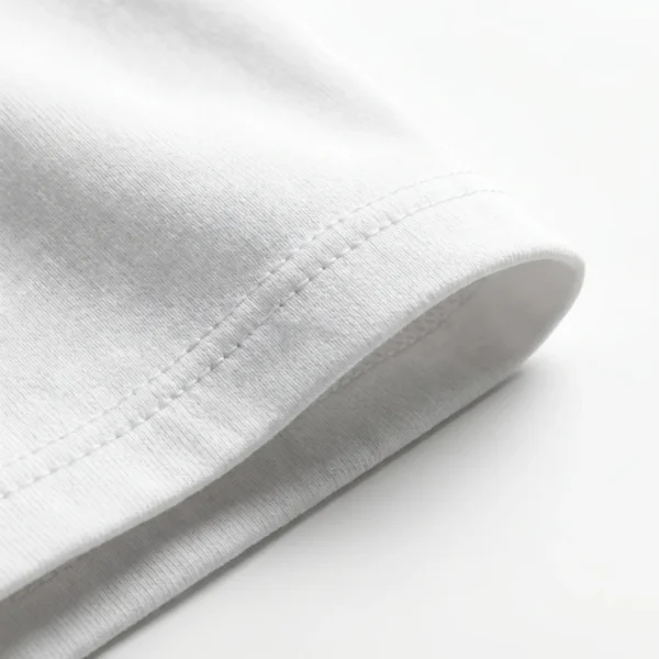 Double-stitched sleeve cuff detail of the Blnk premium oversized blank t-shirt in white.
